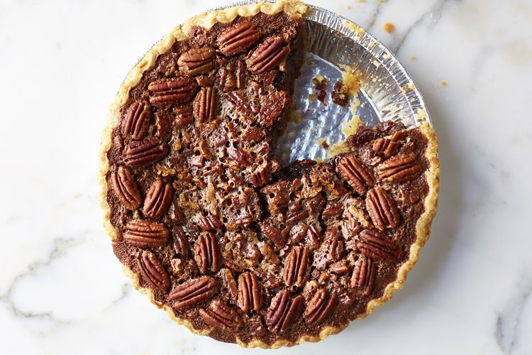 A freshly baked pie adorned with rich chocolate chips on top, inviting dessert lovers to indulge in its sweetness. does Pecan Pie Need to Be Refrigerated?